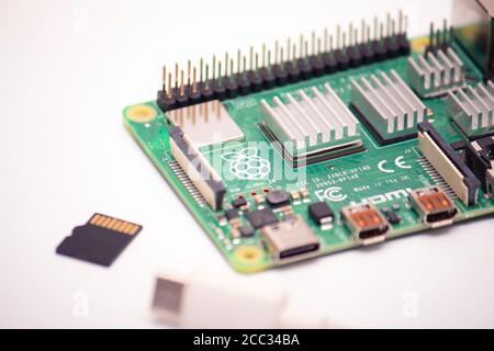 Kiev, Ukraine - August 13th, 2020: microsd card and usb type 3 cord with a single-board micro computer raspberry pi 4 on a white background Stock Photo