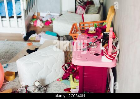 Fragment of a photo of a children's room with scattered things and toys Stock Photo