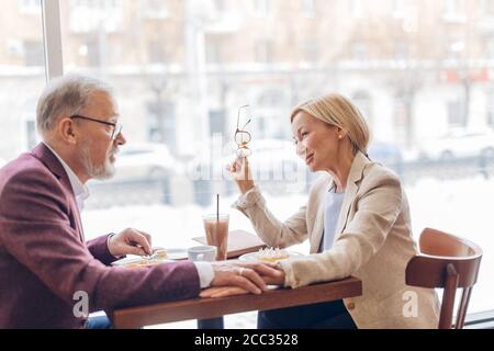relation between woman and man.loving man and woman having a good day indoors.close up side view photo Stock Photo