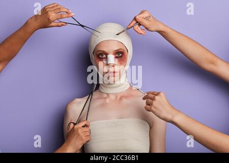 creating new appearance. close up portrait. isolated blue background, studio shot. woman is being done anti aging botox injection Stock Photo