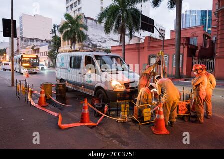 Rio de Janeiro, Brazil - July 2, 2020: Group of electrician workers are making repairs in the city street Stock Photo