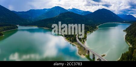 Aerial view of Sylvenstein Dam on cloudy summer day Stock Photo
