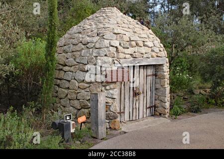 A replica of a Borrie or ox stable in a biome in the Eden Project in Cornwall, England