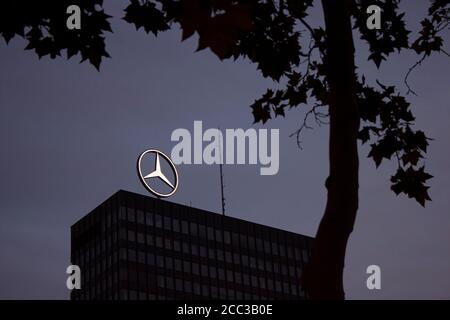 Berlin, Germany 09/14/2009:  isolated night time view of the Europa Center with Mercedes Benz brand logo illuminated on top. Image also features silho Stock Photo