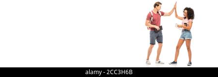 Panoramic shot of multiethnic students giving high five on white background Stock Photo