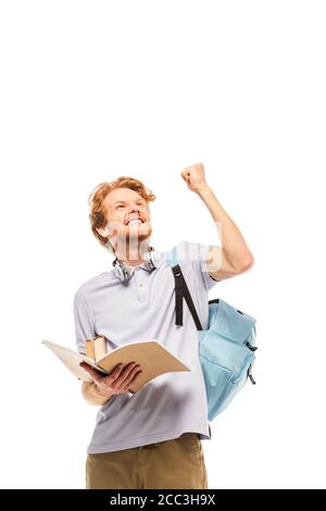 Student holding notebook and showing yeah gesture isolated on white Stock Photo