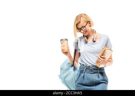Student with backpack, coffee to go and books isolated on white Stock Photo