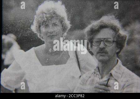 Fine 1970s vintage black and white photography of a man and a woman making an odd couple. Stock Photo