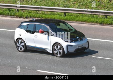 2019 white BMW I3; Vehicular traffic moving vehicles, cars driving vehicle on UK roads, motors, motoring on the M6 motorway highway network. Stock Photo