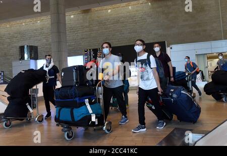 Lod, Israel. 18th Aug, 2020. Travelers wearing protective masks arrive at Ben Gurion International Airport, in Lod, near Tel Aviv, as Israel eases coronavirus air travel restrictions, Tuesday, August 18, 2020. Israelis can travel quarantine free to and from Greece, Croatia and Bulgaria and allowed to return from 17 countries without quarantine. Tourists from defined 'green' countries can enter Israel without mandatory quarantine. Photo by Debbie Hill/UPI Credit: UPI/Alamy Live News Stock Photo