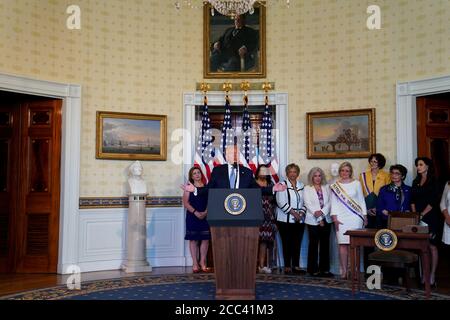 Washington, United States. 18th Aug, 2020. President Donald Trump participates in an event honoring the 100th Anniversary of the Ratification of the 19th Amendment in the Blue Room of the White House in Washington, DC, on August 18, 2020. This year marks the 100th anniversary of the 19th amendment in the United States, which guaranteed American women the right to vote. Pool Photo by Anna Moneymaker/UPI Credit: UPI/Alamy Live News Stock Photo