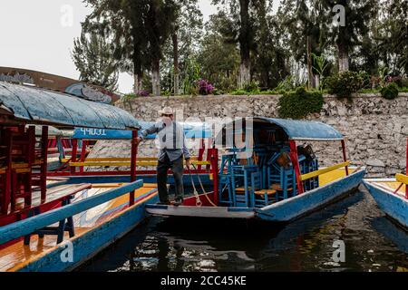 18 August 2020, Mexico, Mexiko-Stadt: The Trajineras of Xochimilco, after being closed for five months due to the pandemic, will reopen for tourists next Saturday. For this reason, the municipality is carrying out disinfection to prevent COVID-19 infection, as it is one of the municipalities that has reported the highest number of cases. Photo: Jacky Muniello/dpa Stock Photo