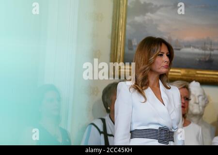 First Lady Melania Trump participates in the signing ceremony to mark the 100th Anniversary of the Ratification of the 19th Amendment at the White House in Washington, DC, USA, 18 August 2020. This year marks the 100th anniversary of the 19th amendment in the United States, which guaranteed American women the right to vote. Credit: Anna Moneymaker/Pool via CNP /MediaPunch Stock Photo