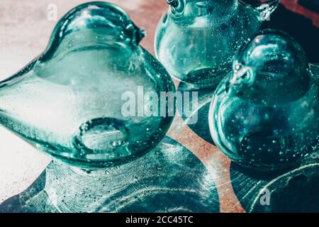 Decorative objects in blown glass on a table outdoor. High quality photo Stock Photo