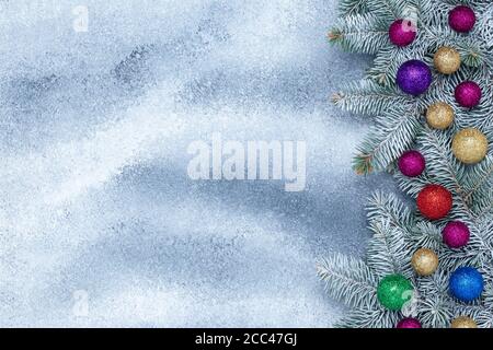 Christmas background with shiny balls and fir branches, holiday gift card, festive frame, new year banner with decorations. Place for text, copy space Stock Photo