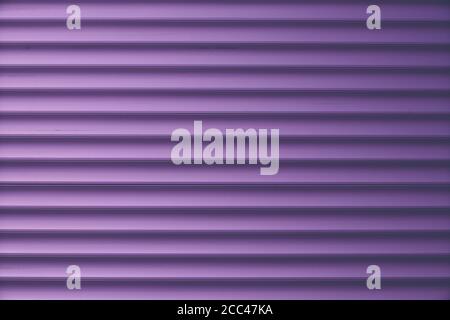 Dark purple siding, metallic striped background, shiny metal fence surface. Convex wall texture. Ribbed blinds, door. Abstract pattern of lines Stock Photo