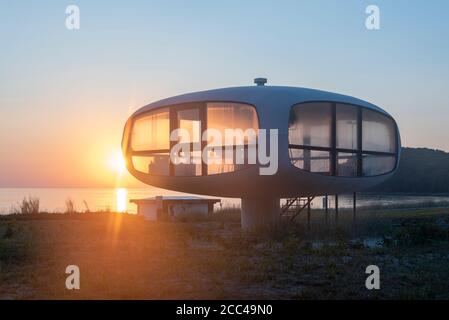 Binz, Germany. 15th Aug, 2020. Sunrise at the Müther Tower. The futuristic building was erected in 1981 as a rescue tower at a Baltic Sea entrance. It was built by the shell concrete master builder Ulrich Müther. Today the tower serves as a wedding room for weddings. Credit: Stephan Schulz/dpa-Zentralbild/ZB/dpa/Alamy Live News Stock Photo