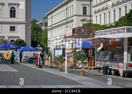 Munich, Germany - August 9, 2020: 'Dult mal anders' bavarian afternoon on Wittelsbacherplatz with music and people dancing with traditional costumes Stock Photo