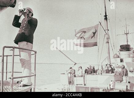 Soviet sailors – the crew of the destroyer of the Red Navy, are watching the air situation around their warship. 1942 Stock Photo