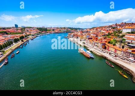 Douro river and local houses with orange roofs in Porto city aerial panoramic view. Porto is the second largest city in Portugal. Stock Photo