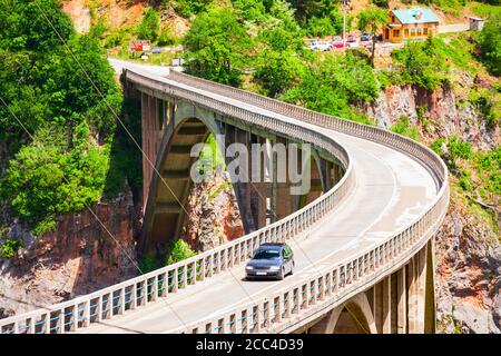 Car on the Djurdjevic Tara Bridge over the Tara River near Zabljak in Montenegro Stock Photo