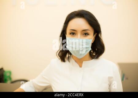 Asian woman doctor nurse wearing protection mask on face Stock Photo