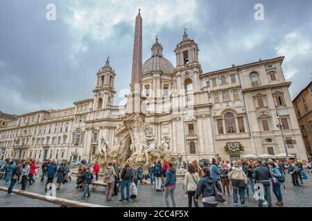 Rome, Italy - May 14, 2016: Fountain of the Four Rivers with an Egyptian obelisk and Sant Agnese Church on the Piazza Navona Stock Photo