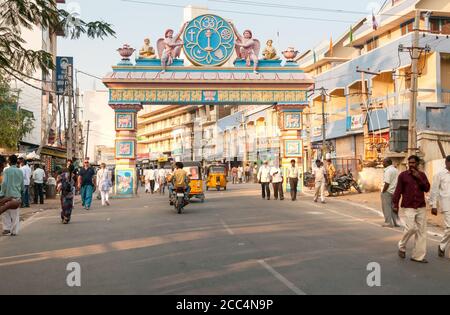 Puttaparthi, Andhra Pradesh, India - January 11, 2013: The symbolic archway to access Puttaparthi village, urban scene, India Stock Photo