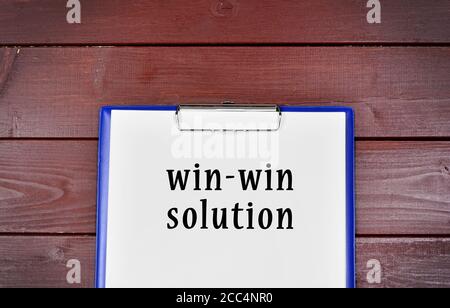 Win-Win solution concept written on paper on a wooden table Stock Photo