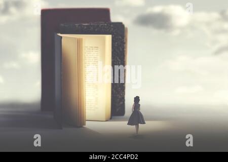 concept of art and fantasy of a magic book and a small woman Stock Photo