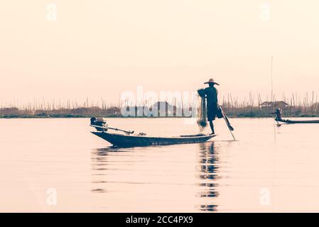 Intha traditional leg rowing fisherman on Inle lake, Burma, Myanmar Stock Photo