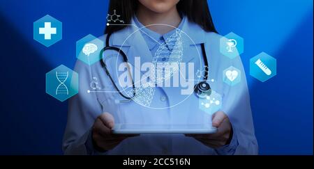 Medical genetics. Female doctor holding tablet computer with DNA helix and other medical icons above screen, collage Stock Photo