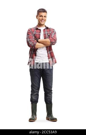 Full length portrait of a male gardener in boots posing with crossed arms isolated on a white background Stock Photo