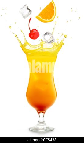 cherry, ice and orange falling into a tequila sunrise cocktail splashing Stock Photo