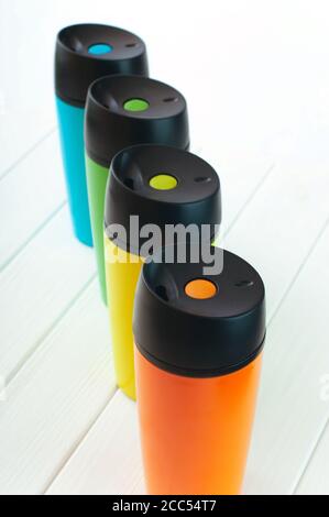 Color thermos mugs on the white background Stock Photo