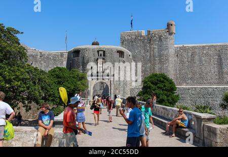 Dubrovnik, Croatia - July 15th 2018: Tourists crowding at the Pile Gate and draw bridge at the entrance to the old town in Dubrovnik, Croatia Stock Photo