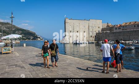Dubrovnik, Croatia - July 15th 2018: Tourists at the harbour in Dubrovnik's old town at the Maritime Museum, Croatia Stock Photo