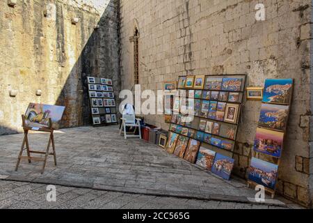 Dubrovnik, Croatia - July 15th 2018: An artists stall in Dubrovnik's old town in a late summers afternoon, Croatia Stock Photo