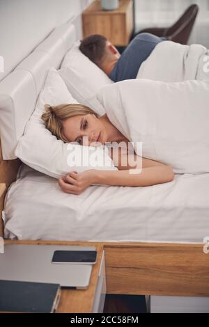 Family couple spending time in bed at home Stock Photo