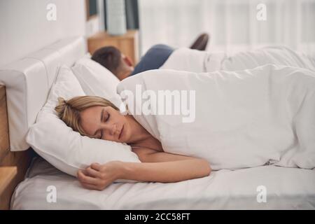 Young family couple staying in bed at home Stock Photo