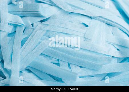 Blue shredded present paper texture background Stock Photo