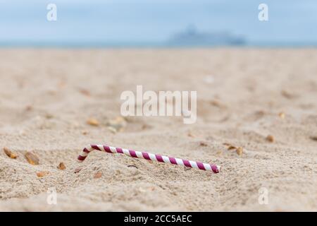 Plastic Pollution: Dropped straw. Bournemouth, UK. Stock Photo