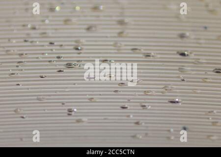 Transparent Polycarbonate plastic sheet with drops, background texture with space for text Stock Photo