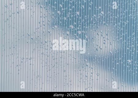 Transparent Polycarbonate plastic sheet with drops, background texture with space for text Stock Photo