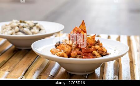 Homemade cavatelli pasta with sauce puttanesca Stock Photo