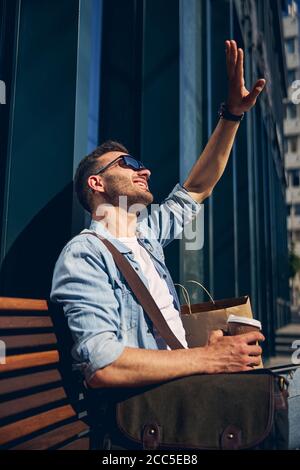 Close up of pleased man that welcoming his friend Stock Photo