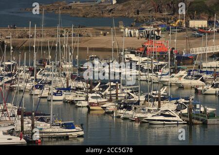 Yachts in the marina with the RNLI lifeboat in the background, Brixham, Devon, UK Stock Photo