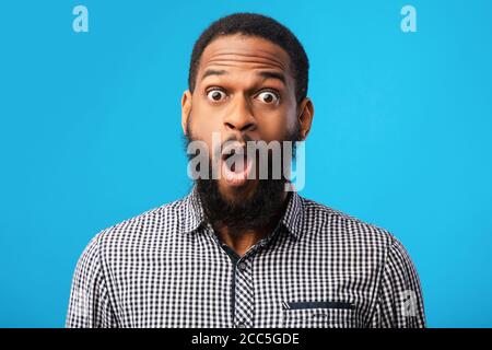 Surprised african american guy looking at camera Stock Photo