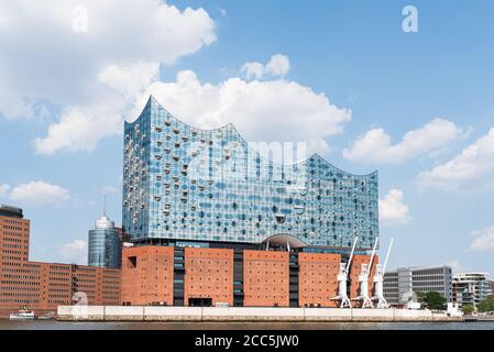2020-08-16 Hamburg, Germany: waterside view of Elbphilharmonie concert hall with Elbe River against blue summer sky