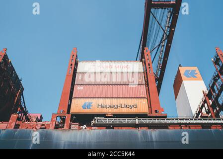 2020-08-16 Hamburg, Germany: low angle view of large cargo containers on container ship operated by Hapag-Lloyd